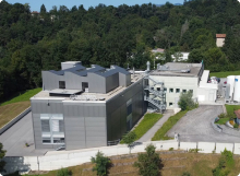 A drone view of Microsphere's pharmaceutical facility. A forest is present in the background.