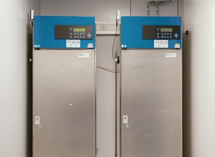 Two stability chambers next to each other inside a pharmaceutical facility.