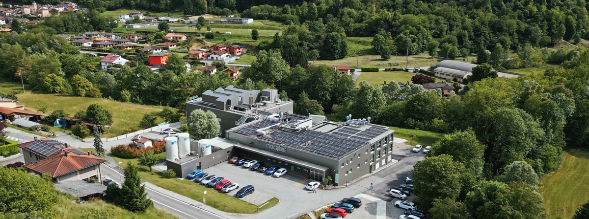 Exterior of the Microsphere pharmaceutical facility . A forest is present in the background.